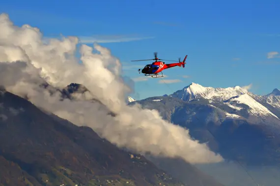 Helicopter Flying Clouds Snow Capped Mountains 1